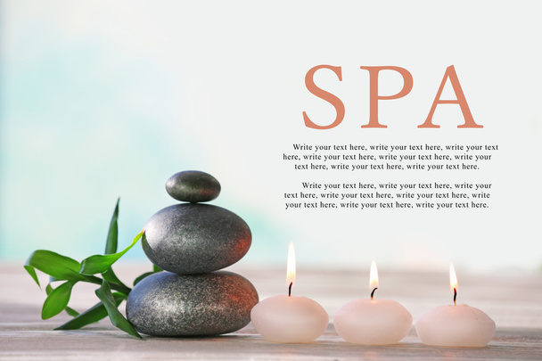 Spa stones with candles and bamboo - Фото, изображение