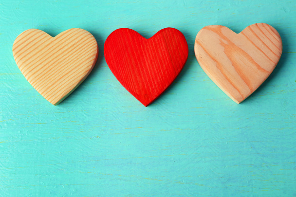 Wooden hearts on color  background - Photo, image