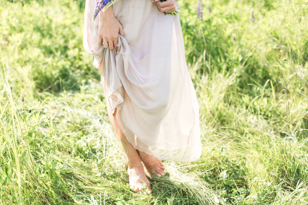 beautiful young woman in dress with beautiful flowers - Фото, зображення