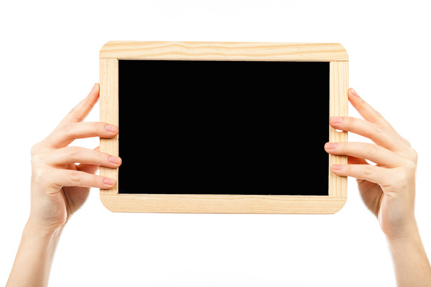 woman's hands holding a board - Foto, afbeelding
