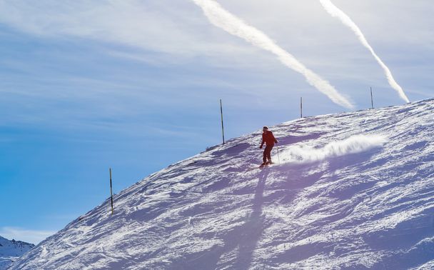 Skier on the slopes of the ski resort - 写真・画像