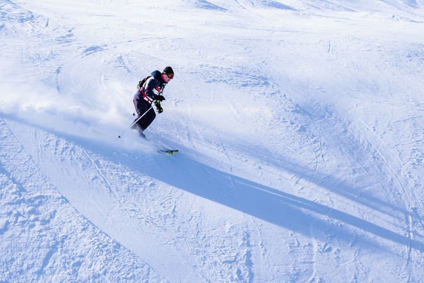 Skier on the slopes of the ski resort - Photo, image