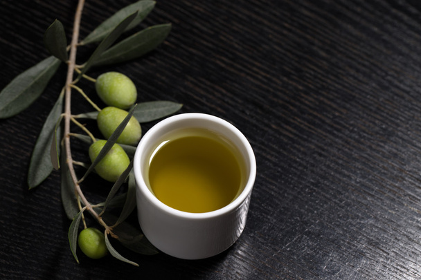Branch of olive tree with green olive berries and cap of fresh o - Photo, Image
