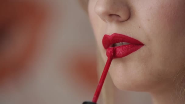beautiful woman paints her lips closeup - Footage, Video