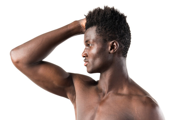 Strong black man posing in studio - 写真・画像