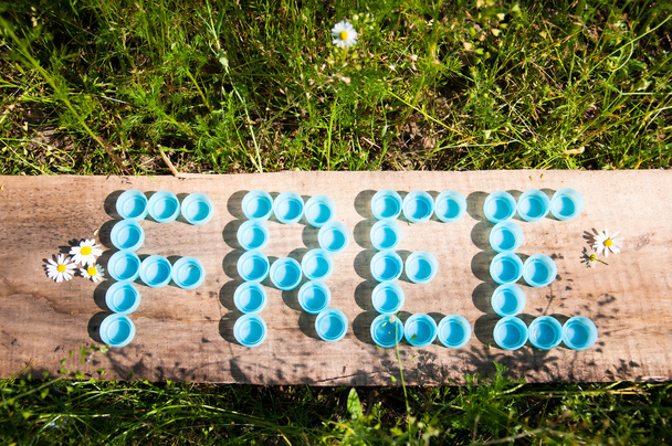 Ücretsiz woodrn tahta üzerinde plastik kapaklar ile oluşan - Fotoğraf, Görsel