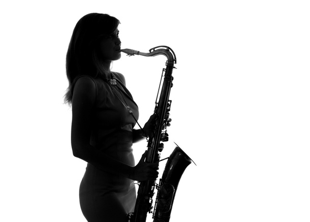 young woman playing the saxophone - Foto, Imagen