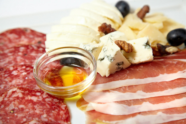 Assorted deli meats and cheese isolated on white - 写真・画像