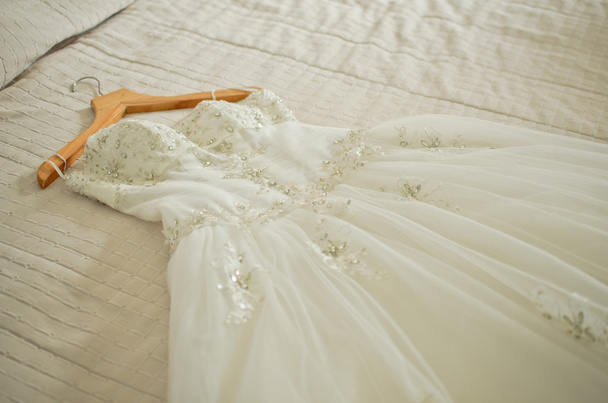 wedding dress on the bed - Photo, Image