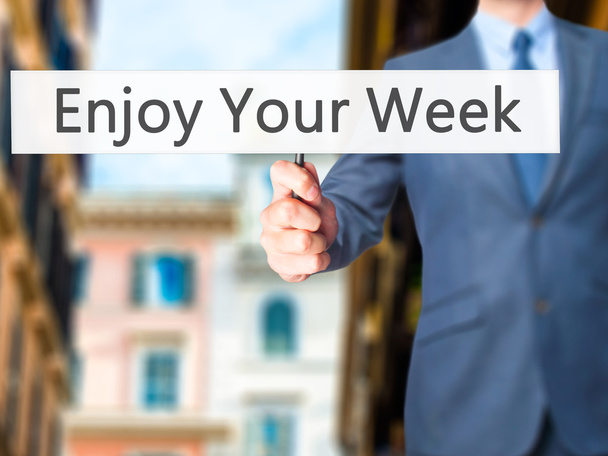 Enjoy Your Week - Businessman hand handing sign
 - Фото, изображение