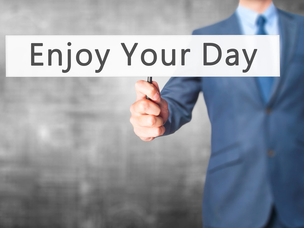 Enjoy Your Day - Businessman hand holding sign - Photo, Image