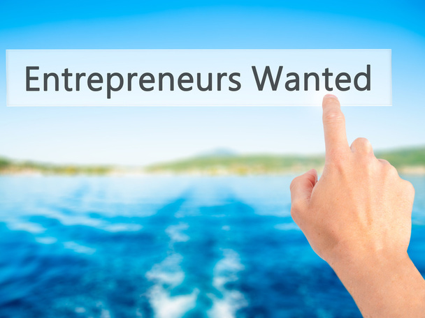 Entrepreneurs Wanted - Hand pressing a button on blurred backgro - Photo, Image