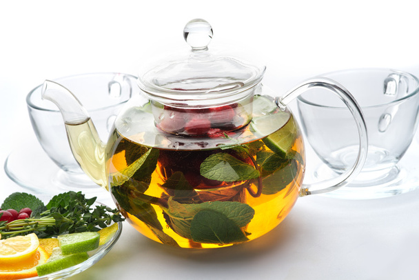 Fruit tea with mint leaves in a teapot - Фото, зображення