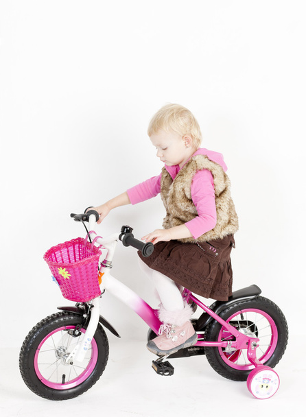 Little girl riding bike - Foto, Imagen