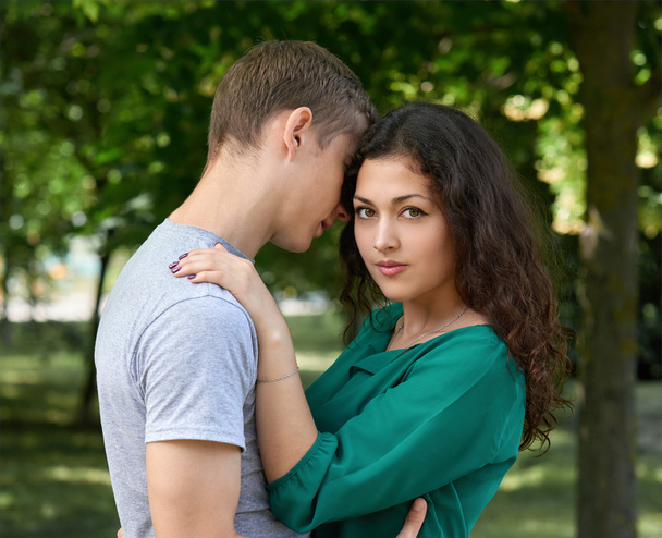 Romantic couple posing in city park, summer season, lovers boy and girl - Photo, Image