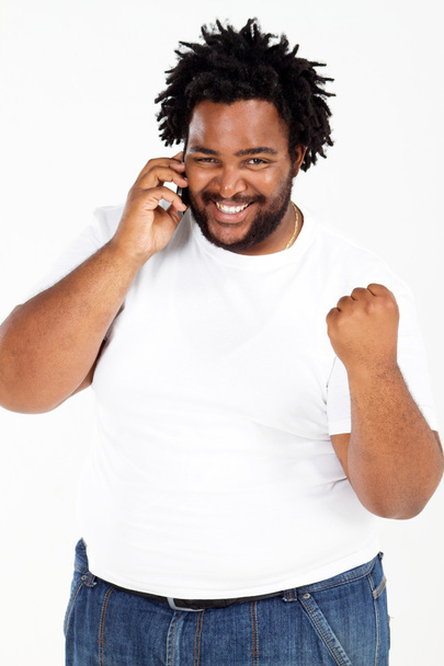 Happy african american man talking on the phone - Photo, image