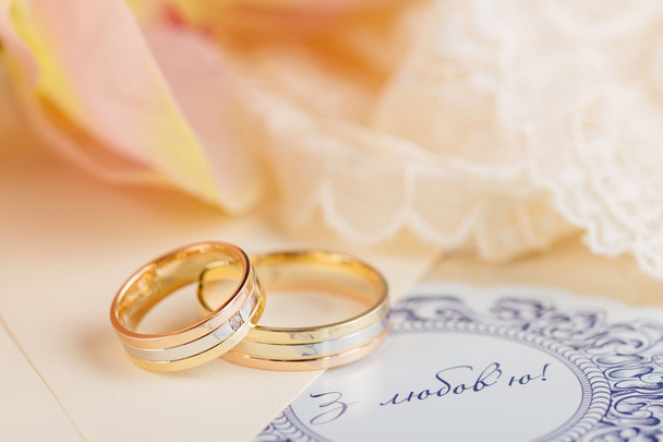 Golden wedding rings - Фото, изображение