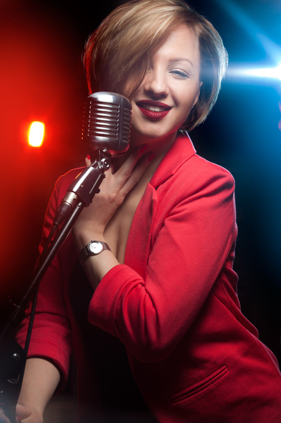 Woman with retro microphone - Foto, afbeelding