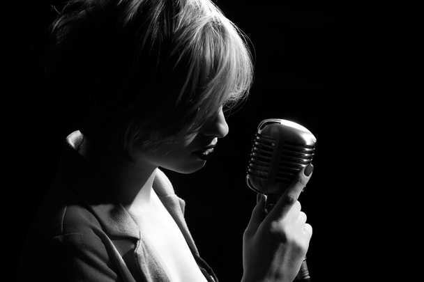 Woman with retro microphone - Photo, image