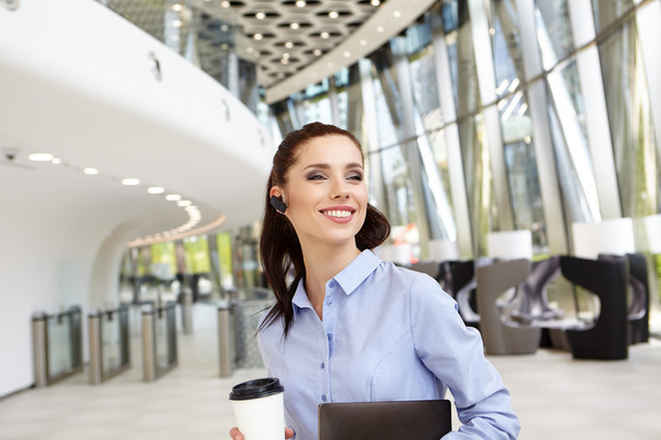 Businesswoman holding a cup of coffee - Photo, Image