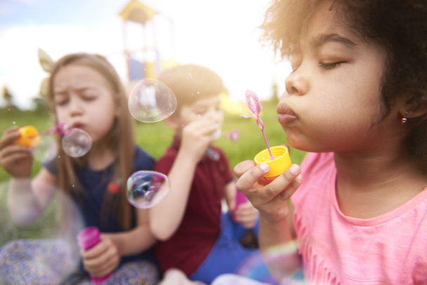 Blowing bubbles with little friends  - Photo, Image