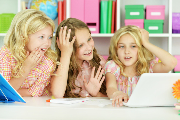 beautiful little girls with laptop - Fotó, kép