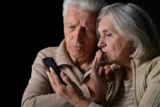 sad  Senior couple with phone - Valokuva, kuva