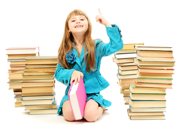 Little girl with a books isolated on white - Фото, изображение