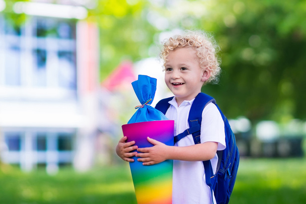Little child with candy cone on first school day - Photo, Image