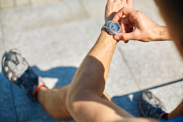 athlete with watch - Фото, изображение
