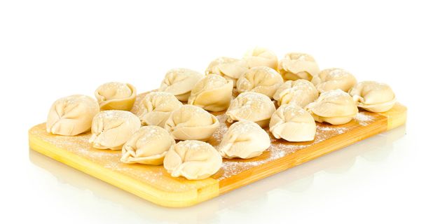 Raw Dumplings on cutting board isolated on white - Foto, Bild
