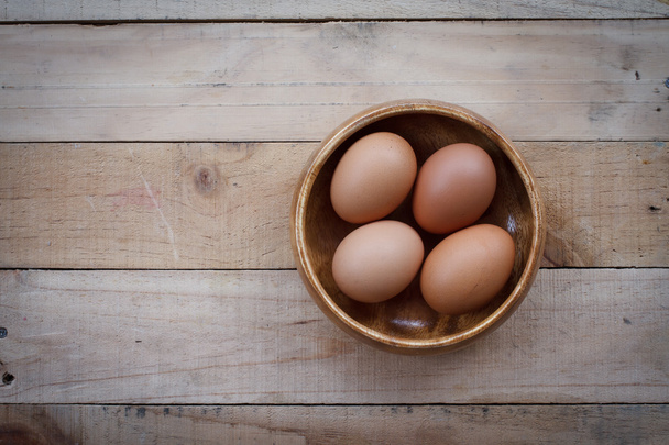 Eggs on wooden texture background - Photo, Image
