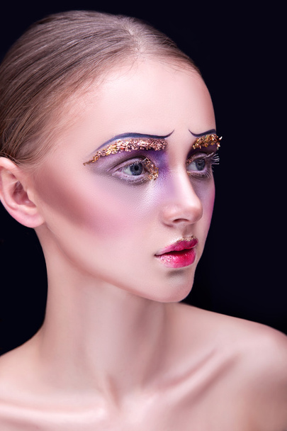 portrait of a beautiful young girl with professional makeup - Fotó, kép