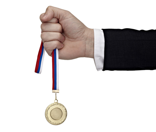 Business hand holding golden medal - Foto, Bild