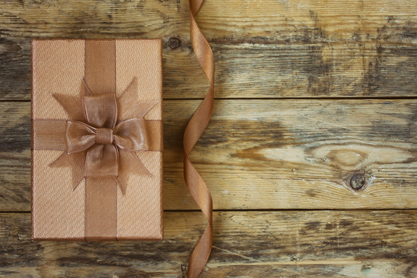 Brown gift box with silk ribbon  - 写真・画像