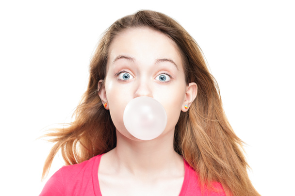 Girl blowing bubble from chewing gum - Fotoğraf, Görsel