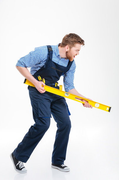Full length portrait of a funny male builder - Photo, image