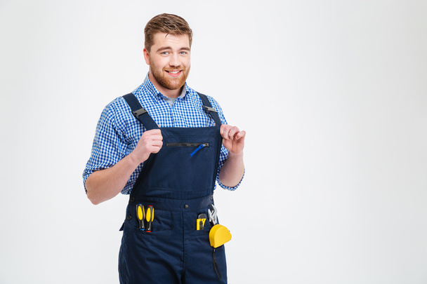 Smiling handsome male builder looking at camera - 写真・画像
