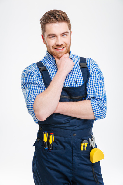 Happy thoughtful male builder looking at camera - Foto, Imagem