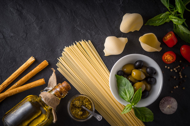 Set of Italian food on the black stone table top view - Valokuva, kuva