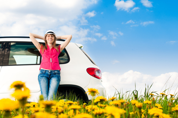 Woman and her car in the field - Foto, immagini
