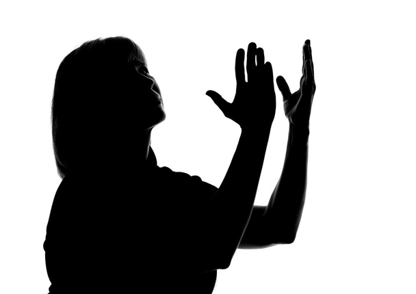 silhouette of a woman raise their hands to the sky - Фото, изображение