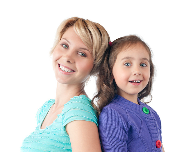 Happy mother and daughter smiling in studio - Photo, Image