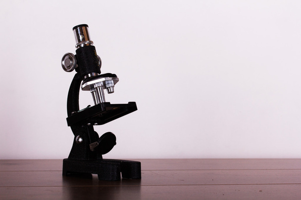 Microscope on a table for science background - Zdjęcie, obraz
