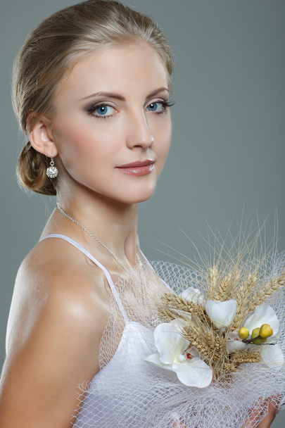 A beautiful sexual bride is in a wedding-dress, wedding decoration - Foto, imagen