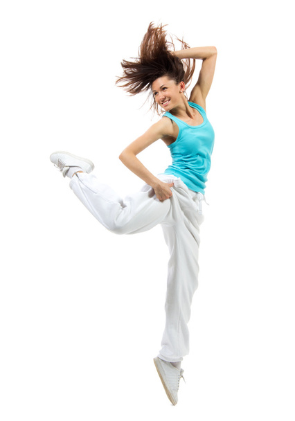 Happy slim woman dancer dancing jumping looking at the corner - Zdjęcie, obraz