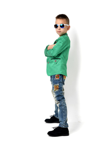 Fashion beautiful little boy in sunglasses blue cloth jeans stan - Foto, imagen