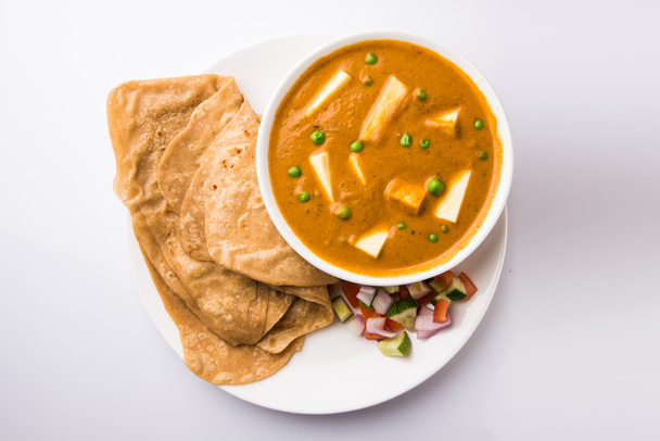 indian food paneer butter masala served with chapati / roti / paratha / fulka / indian bread with green salad - Photo, Image