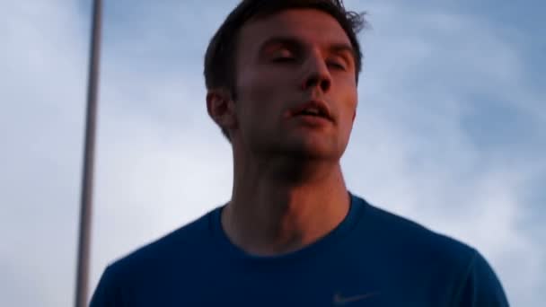 Closeup of the face of the athlete while Jogging - Felvétel, videó