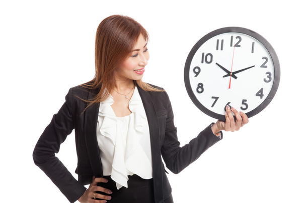 Young Asian business woman with a clock - Fotografie, Obrázek